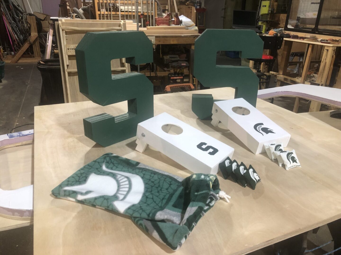 A table with some green and white letters on it